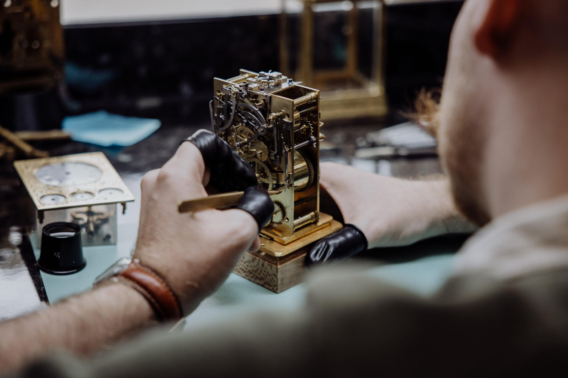 clock technician at work